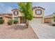 Charming two-story home with a two-car garage and desert landscaping in the front yard at 694 W Desert Seasons Dr, San Tan Valley, AZ 85143