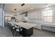 A bright kitchen showcases a large island with seating, stainless steel appliances, and white marble countertops and backsplash at 694 W Desert Seasons Dr, San Tan Valley, AZ 85143