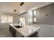 The living space offers an open floor plan, lots of natural light, tile flooring, and access to the backyard through sliding glass doors at 694 W Desert Seasons Dr, San Tan Valley, AZ 85143