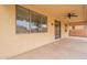 Covered patio with ceiling fan, offering an outdoor living space with window views at 694 W Desert Seasons Dr, San Tan Valley, AZ 85143