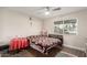 Bedroom with a ceiling fan, tile floors and natural light at 7502 W Cora Ln, Phoenix, AZ 85033