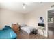Bedroom featuring tile floor, two beds and a large window at 7502 W Cora Ln, Phoenix, AZ 85033