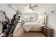 Bright bedroom with a neutral color palette, ceiling fan and large window at 7502 W Cora Ln, Phoenix, AZ 85033