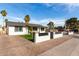 Stylish white home featuring well-maintained landscaping, a privacy fence, and a covered patio perfect for entertaining at 7502 W Cora Ln, Phoenix, AZ 85033