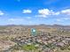 Beautiful community with desert views and green spaces, perfect for outdoor living at 7939 W Fetlock Trl, Peoria, AZ 85383