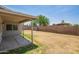 Spacious backyard features a covered patio and block fence, ready for landscaping at 8807 W Cinnabar Ave, Peoria, AZ 85345
