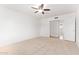 A bright bedroom with carpet flooring with a ceiling fan to keep you cool and comfortable at 8807 W Cinnabar Ave, Peoria, AZ 85345
