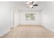 Bright bedroom features neutral carpet, a ceiling fan, and a window for natural light at 8807 W Cinnabar Ave, Peoria, AZ 85345