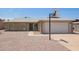 Charming single-story home featuring a two-car garage, complemented by low-maintenance desert landscaping at 8807 W Cinnabar Ave, Peoria, AZ 85345