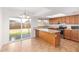 An updated kitchen with granite countertops and stainless steel appliances adjacent to a breakfast nook at 8807 W Cinnabar Ave, Peoria, AZ 85345