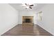 Spacious living room featuring beautiful brick fireplace and modern flooring that enhances this living space at 8807 W Cinnabar Ave, Peoria, AZ 85345