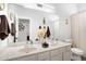 Bright bathroom featuring a double sink vanity with neutral countertops and modern fixtures at 9545 E Gary St, Mesa, AZ 85207