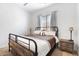 Bedroom featuring iron frame bed and a calming atmosphere at 9545 E Gary St, Mesa, AZ 85207