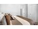 Bedroom featuring neutral-toned bedding and a bright, airy ambiance at 9545 E Gary St, Mesa, AZ 85207