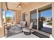 Inviting covered patio with comfortable seating and sliding glass doors at 9545 E Gary St, Mesa, AZ 85207