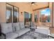 Relaxing covered patio with plush outdoor seating and ceiling fan at 9545 E Gary St, Mesa, AZ 85207