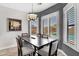 Elegant dining room with plantation shutters and a view of the pool at 9545 E Gary St, Mesa, AZ 85207