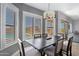 Bright dining room offering backyard views and an elegant chandelier at 9545 E Gary St, Mesa, AZ 85207