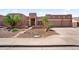 Charming home features a three-car garage, desert landscaping, and lovely curb appeal at 9545 E Gary St, Mesa, AZ 85207