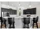 Eat-in kitchen featuring black cabinets, stainless steel appliances and seating for three at 9545 E Gary St, Mesa, AZ 85207