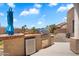 Outdoor kitchen with built-in grill, beverage cooler, and counter space at 9545 E Gary St, Mesa, AZ 85207