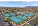 Aerial view of the community tennis courts and pool, nestled within the residential area at 11360 E Keats Ave # 20, Mesa, AZ 85209
