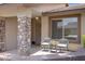 Inviting front porch with comfortable seating and stone column accents at 11360 E Keats Ave # 20, Mesa, AZ 85209