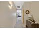 Hallway leading into the spacious living area with modern decor at 11360 E Keats Ave # 20, Mesa, AZ 85209