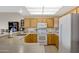Bright kitchen with wooden cabinets, white appliances, and light countertops at 11360 E Keats Ave # 20, Mesa, AZ 85209
