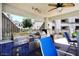 A stylish outdoor kitchen features stainless steel appliances, and a ceiling fan at 11375 E Sahuaro Dr # 2064, Scottsdale, AZ 85259