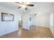 Cozy bedroom featuring tile floors, ceiling fan, and a closet with mirrored doors at 12434 S Ki Cir, Phoenix, AZ 85044