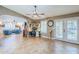 Open concept great room with ceiling fan, French doors and a built-in desk area at 12434 S Ki Cir, Phoenix, AZ 85044