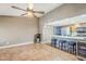 Open concept great room featuring tile flooring, and view of kitchen with breakfast bar seating at 12434 S Ki Cir, Phoenix, AZ 85044