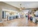 Open concept great room with kitchen, desk area, and living room, all open to each other at 12434 S Ki Cir, Phoenix, AZ 85044