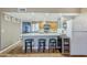 Kitchen features stainless steel appliances, breakfast bar with seating for three at 12434 S Ki Cir, Phoenix, AZ 85044