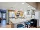 Kitchen with stainless steel appliances, breakfast bar seating and tile floors at 12434 S Ki Cir, Phoenix, AZ 85044
