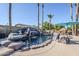 Stunning rock waterfall feature enhances the pool, creating a tropical oasis in the backyard at 12434 S Ki Cir, Phoenix, AZ 85044
