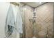 Shower stall features tiled walls, showerhead and a corner rack at 12434 S Ki Cir, Phoenix, AZ 85044