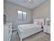 Cozy bedroom with natural light, white furniture, and minimalist decor at 13162 W Golden Puma Trl, Peoria, AZ 85383