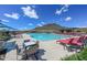 Inviting community pool area featuring ample seating and shade at 13162 W Golden Puma Trl, Peoria, AZ 85383