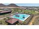 Community pool includes lounge chairs, umbrellas, and a separate splash pad for  at 13162 W Golden Puma Trl, Peoria, AZ 85383
