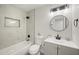 Bathroom featuring marble wall, updated sink and fixtures at 1427 W 6Th Dr, Mesa, AZ 85202