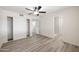 Minimalist bedroom design featuring wood flooring, a ceiling fan, and closet at 1427 W 6Th Dr, Mesa, AZ 85202