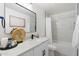 Modern bathroom featuring sleek vanity, updated lighting, walk-in shower, and elegant fixtures at 1535 W Berridge Ln, Phoenix, AZ 85015