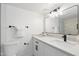 Bright bathroom with a white vanity, an undermount sink, and a black faucet at 1535 W Berridge Ln, Phoenix, AZ 85015