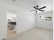 Bright bedroom featuring neutral walls, sleek fan, modern lighting and a large window at 1535 W Berridge Ln, Phoenix, AZ 85015