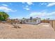 Spacious backyard featuring a pergola, gravel landscaping, and potential for outdoor enjoyment at 1561 N Sterling St, Mesa, AZ 85207