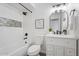Bathroom featuring a shower-tub combo with mosaic accents and modern vanity at 1561 N Sterling St, Mesa, AZ 85207