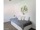 Simple bedroom with a twin bed, extra pillows and drawers for storage at 1561 N Sterling St, Mesa, AZ 85207