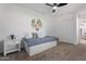 Cozy bedroom featuring a daybed, plush pillows, modern ceiling fan, and closet for ample storage at 1561 N Sterling St, Mesa, AZ 85207